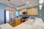Nicely updated kitchen with stainless steel appliances and custom cabinets